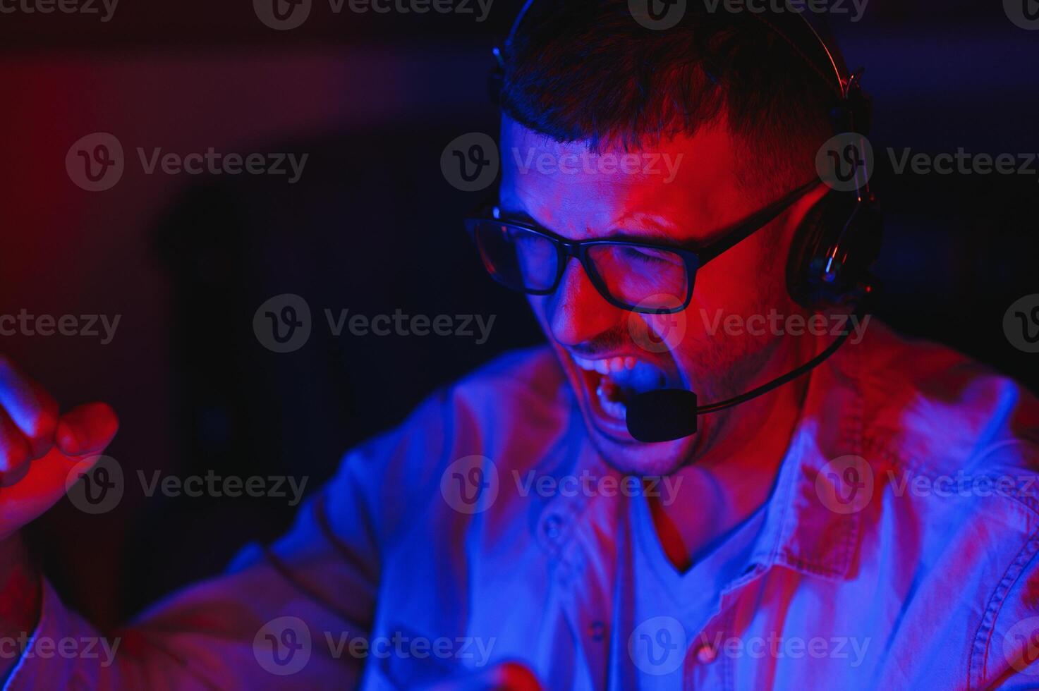 young man playing computer games on line photo
