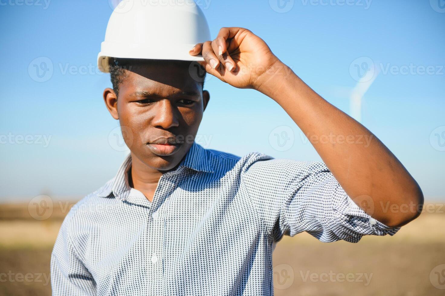 Engineers are investigating the wind turbine. photo
