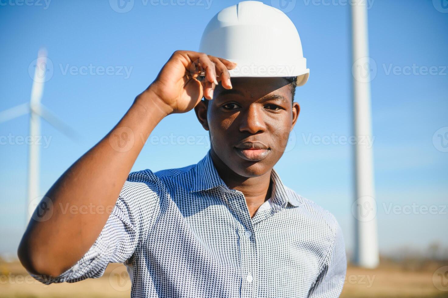 Engineers are investigating the wind turbine. photo