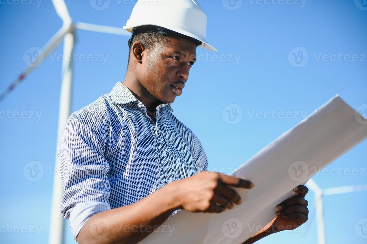 Engineers are investigating the wind turbine. photo