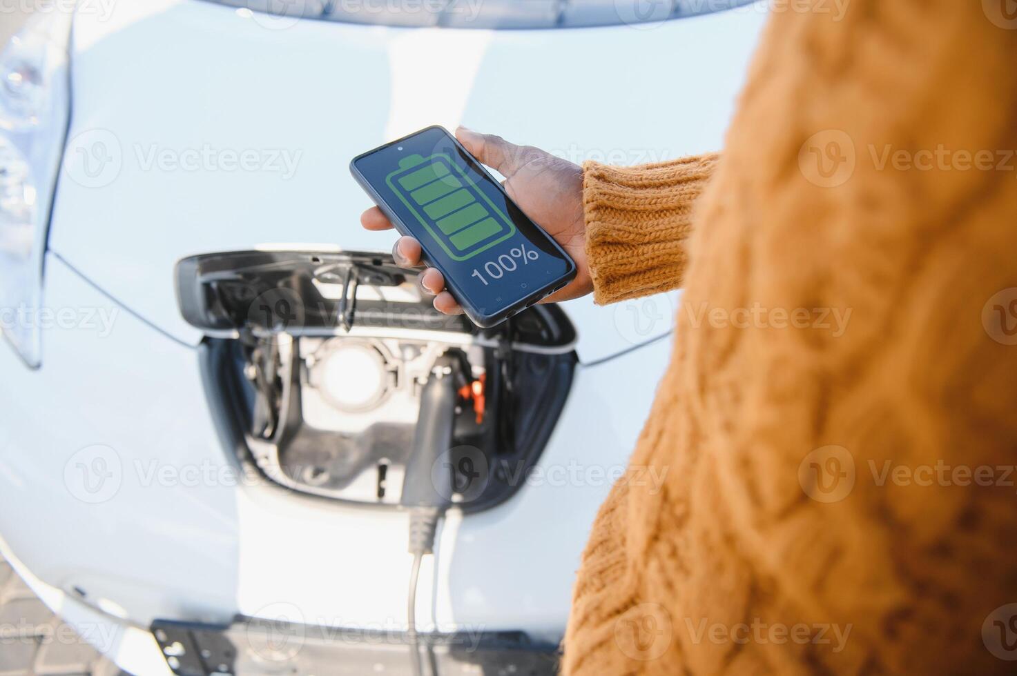 Phone charging in car concept, close up image of smart phone charger in car dashboard photo