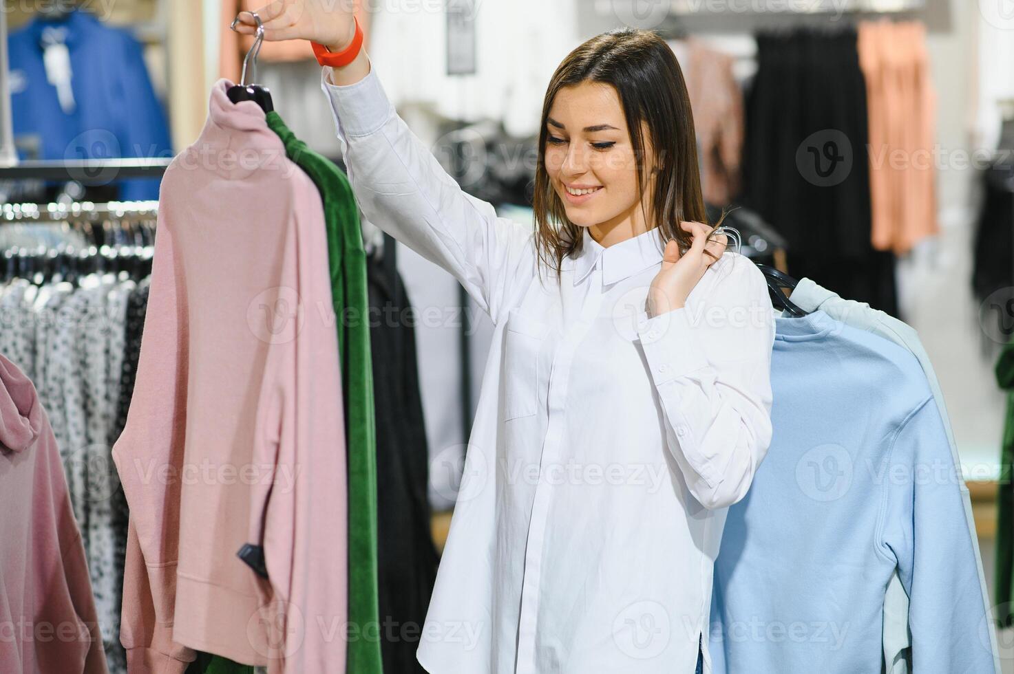 Fashionable girl shopping in a store. photo