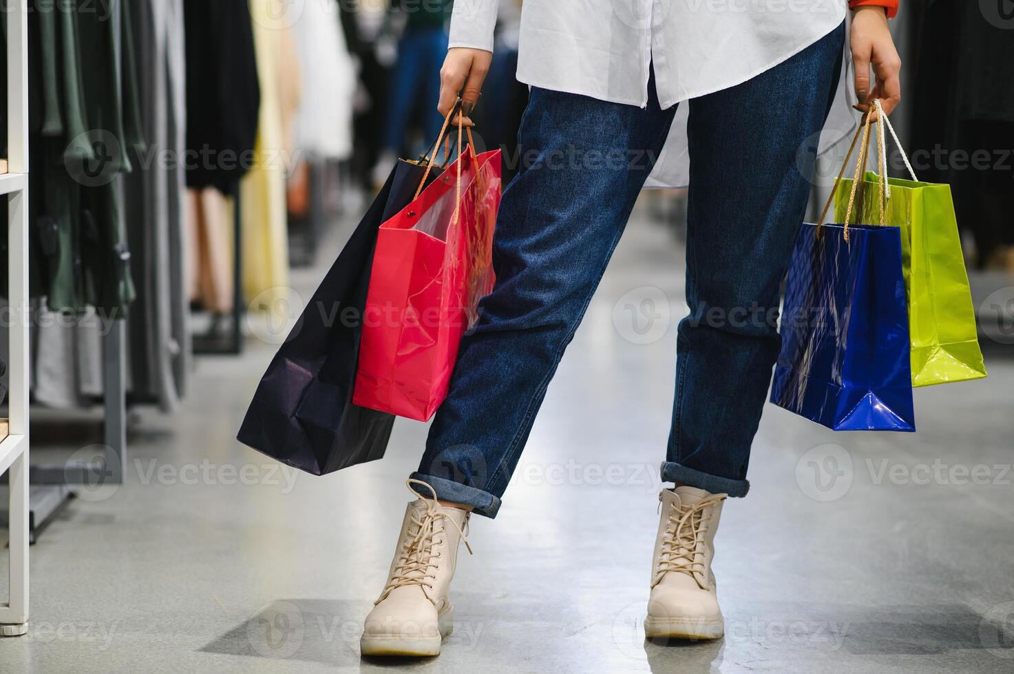 Woman with shopping bags in shop photo
