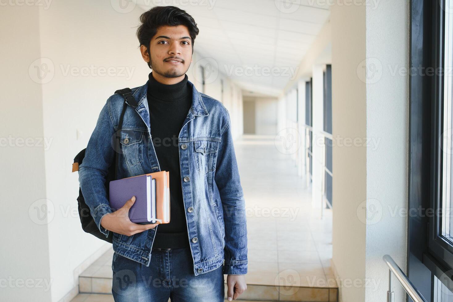 Happy indian male student at the university photo