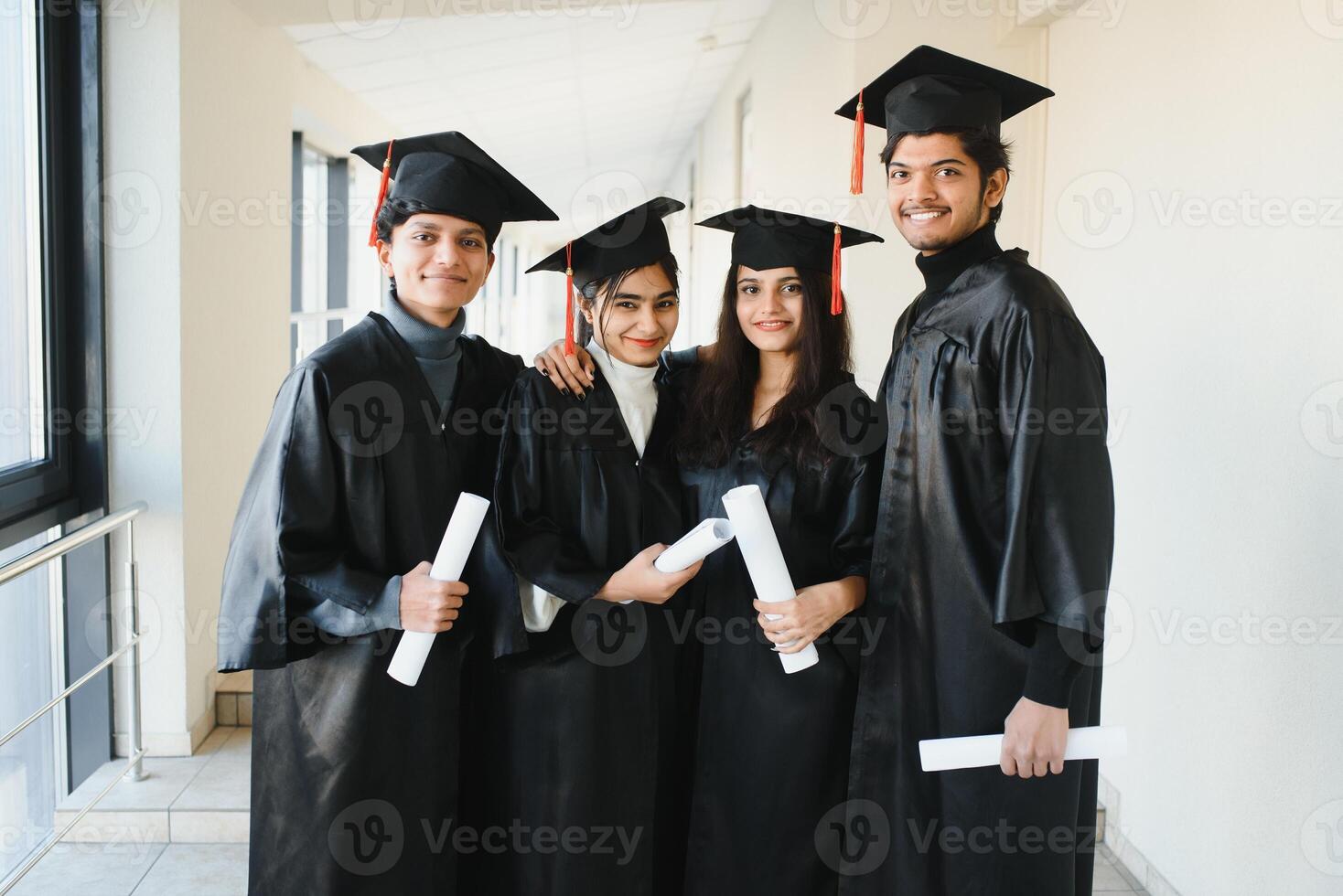 education, graduation and people concept - group of happy international students. group of Indian graduates. photo