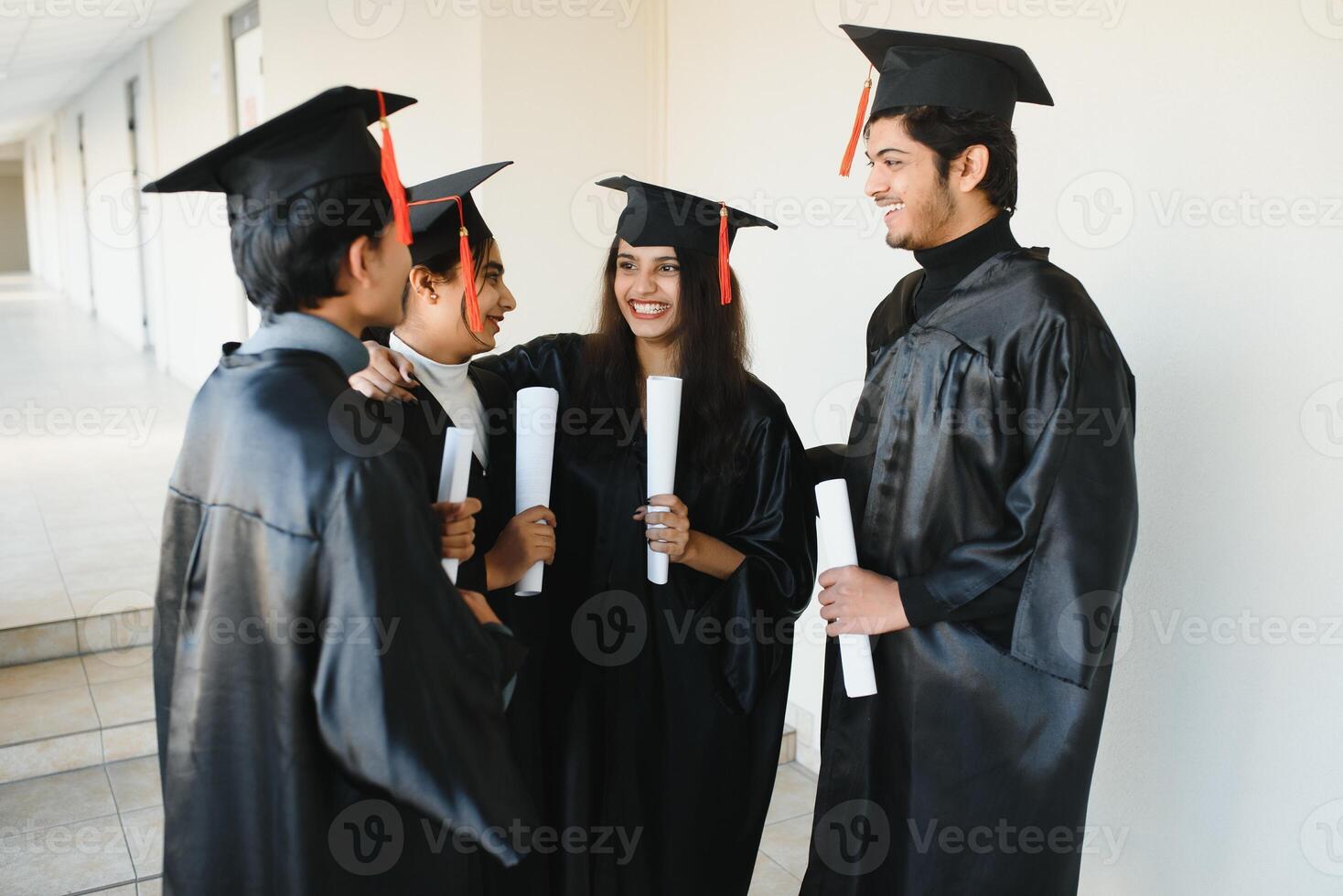 education, graduation and people concept - group of happy international students. group of Indian graduates. photo