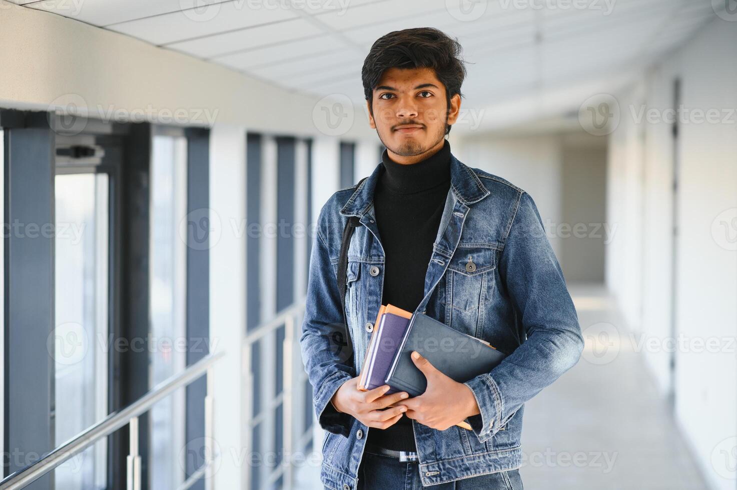 Happy indian male student at the university photo
