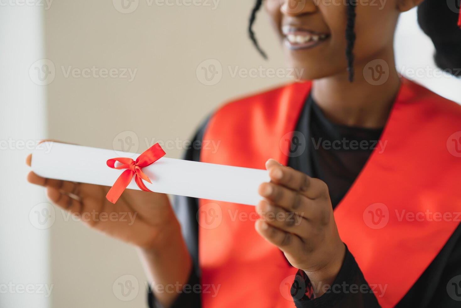 beautiful young afro american graduate holding diploma photo