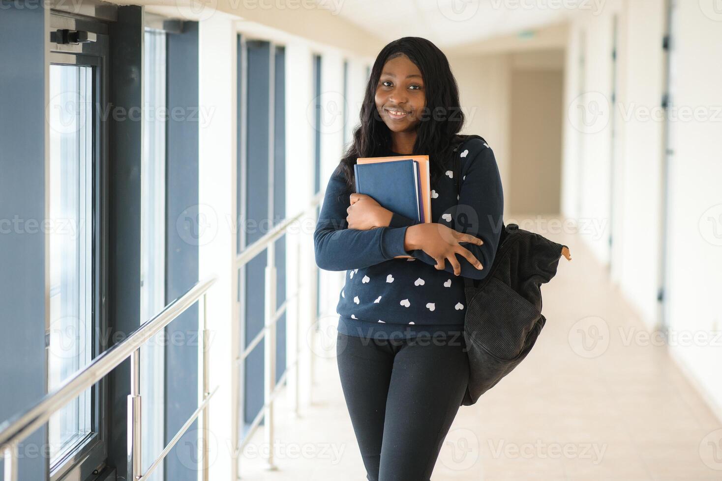 portrait of happy female african american college student photo