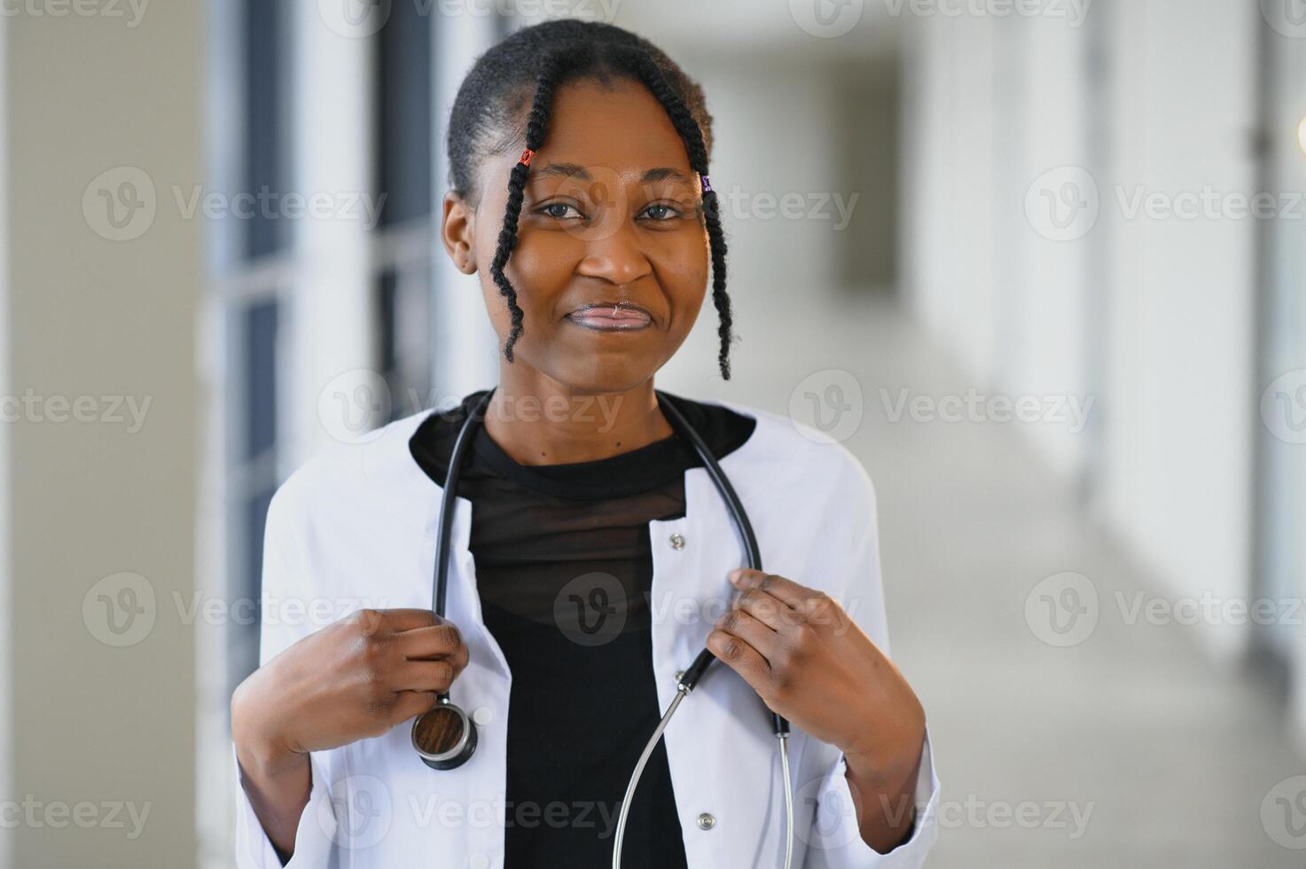 beautiful african american female pediatric nurse in modern office photo