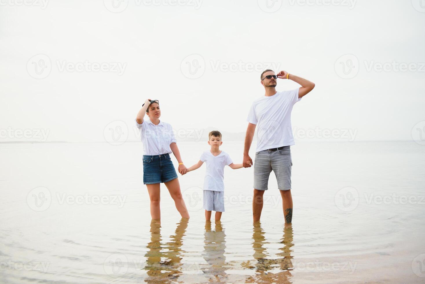 Cute happy family having fun on luxury tropical resort, mother with child, summer holidays, love concept photo