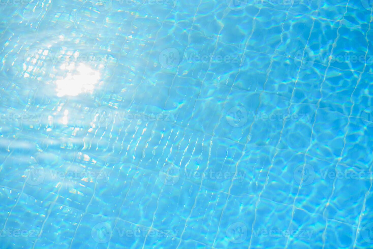 Hotel swimming pool with sunny reflections photo