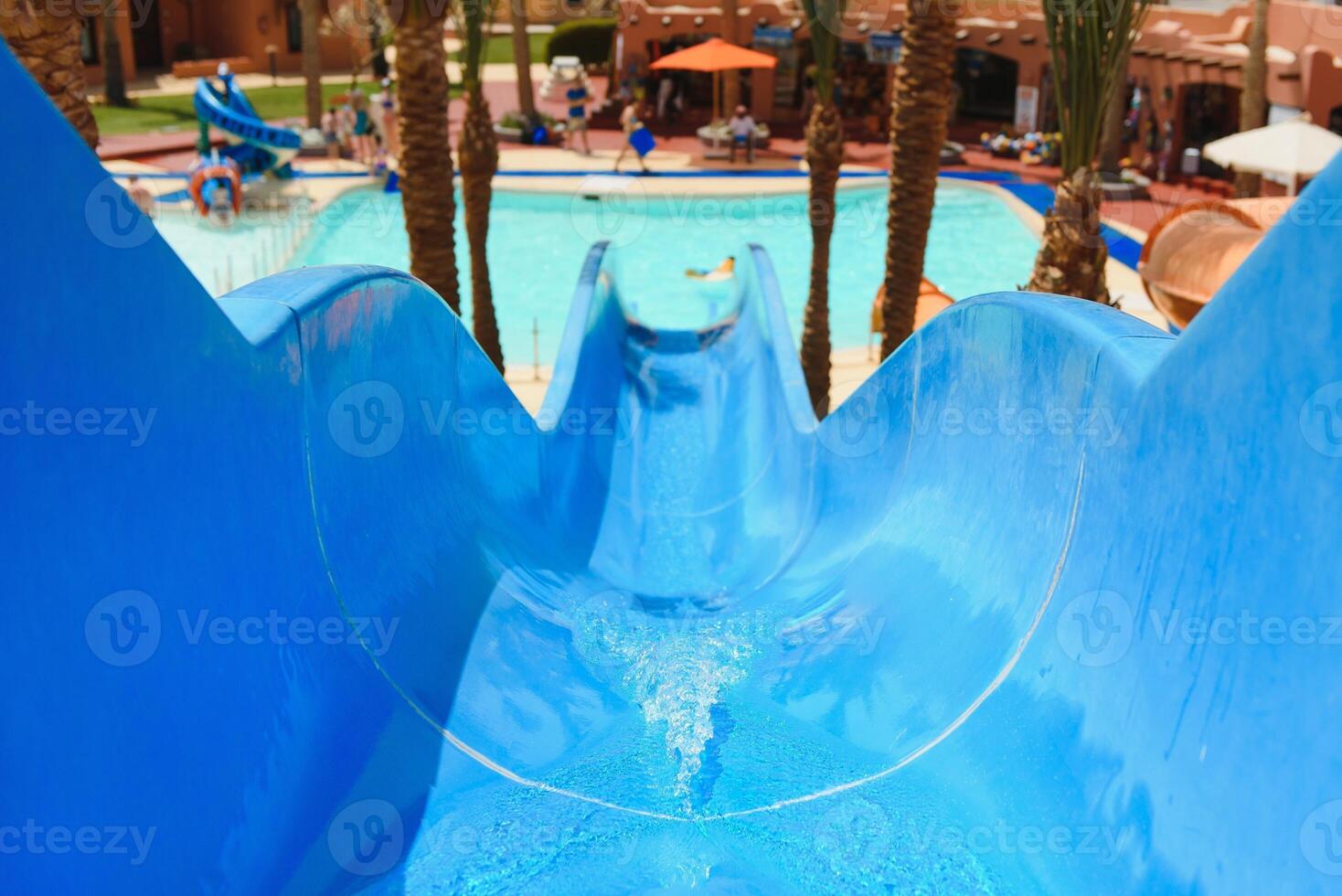 Colorful aquapark constructions in swimming-pool photo