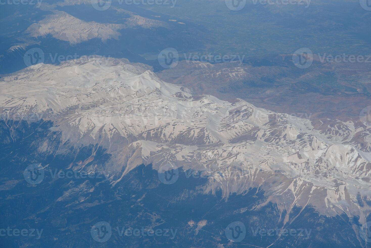 Looking through window aircraft during flight in wing with a nice blue sky photo