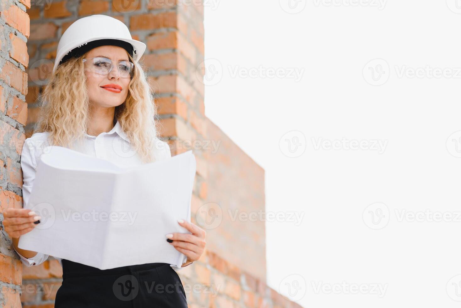 Women Engineer look at Building Glass photo