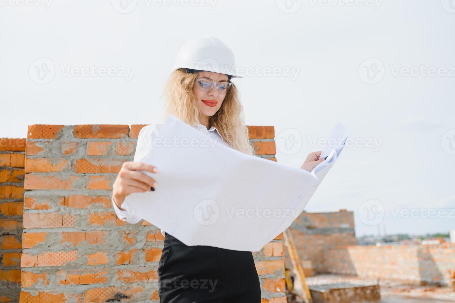 Women Engineer look at Building Glass. photo