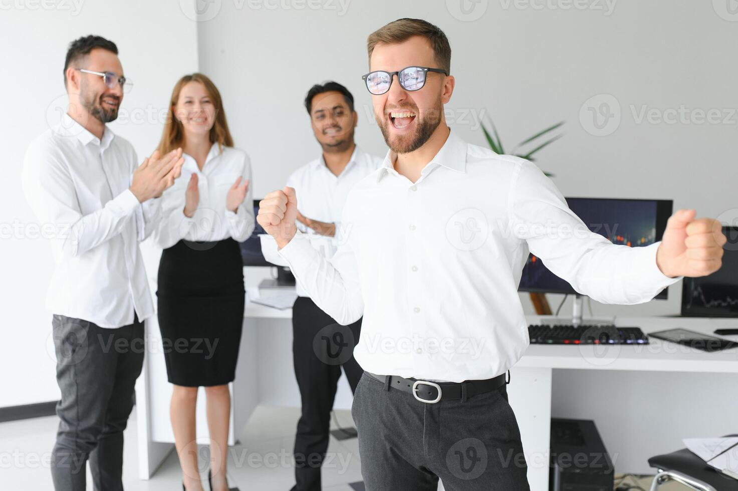 Business people stand on the background of the office corridor photo