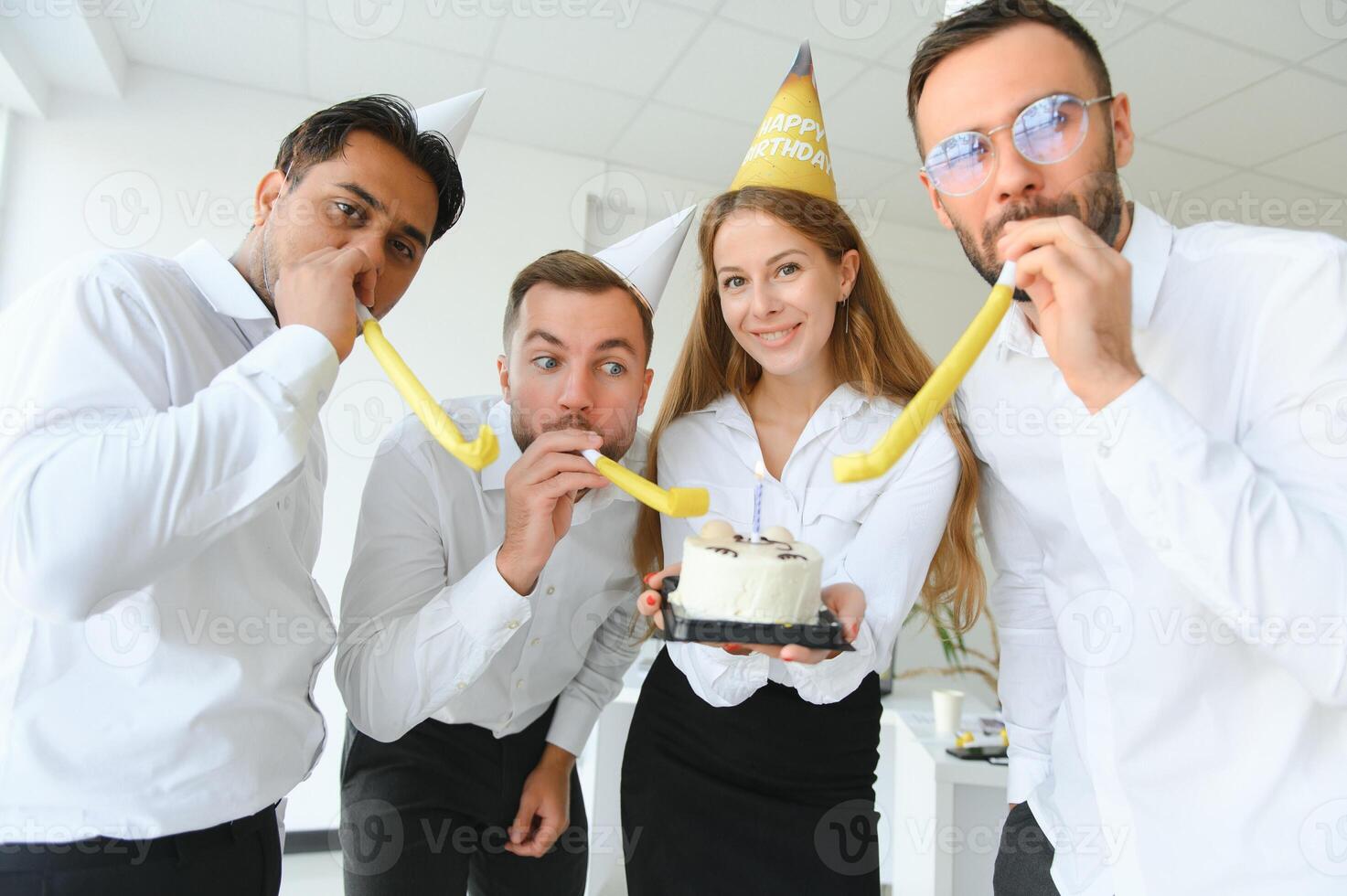 business team celebrating a birthday in the office. photo