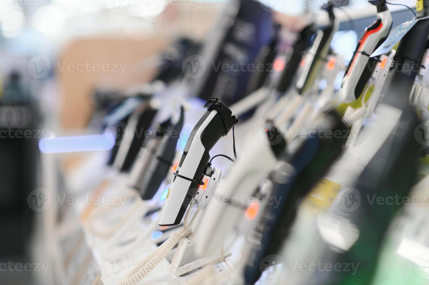Electric shavers on a shelf in a store. Male and female electric razor photo