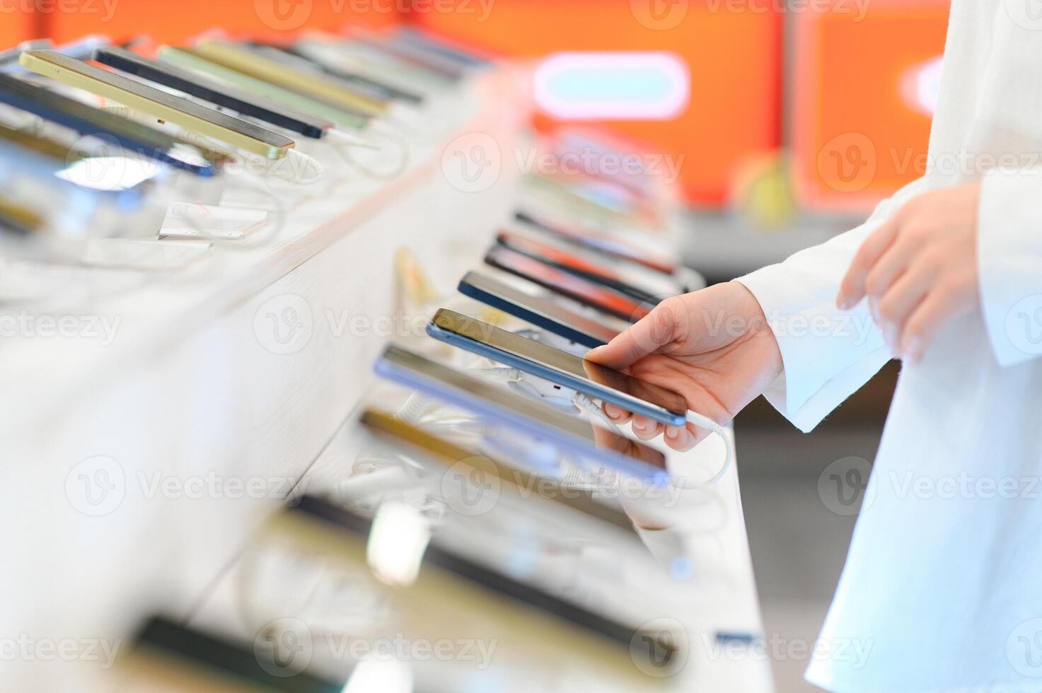 customer choosing a new mobile phone in a shop photo