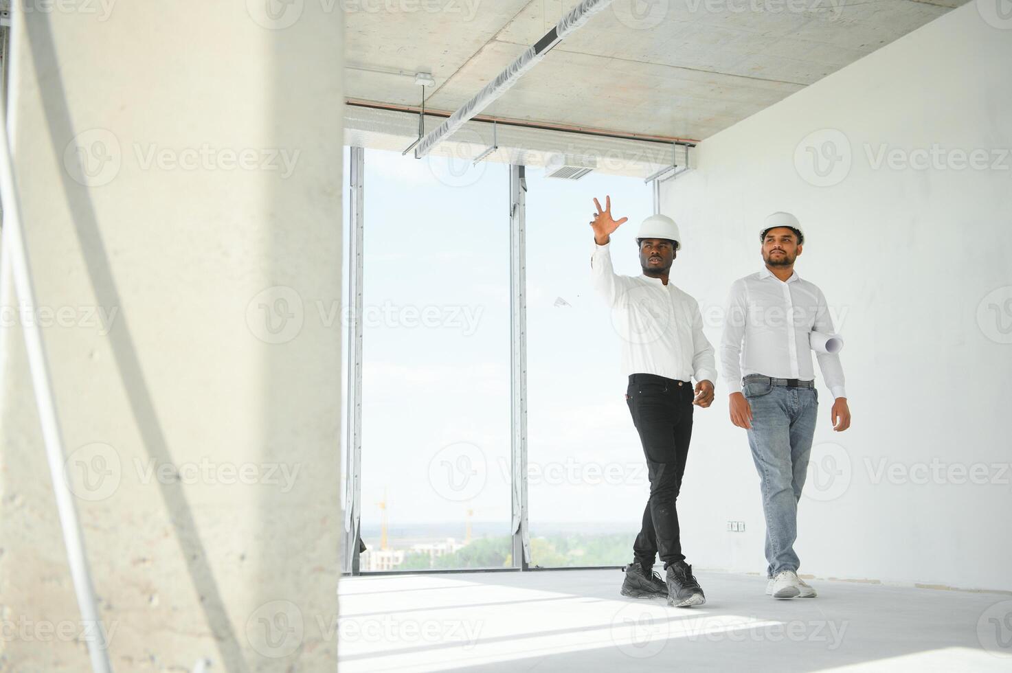 Group of multi ethnic engineer construction site worker meeting at workplace photo