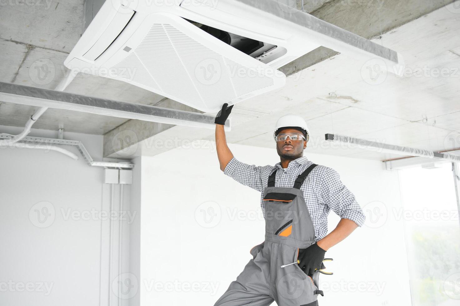 AC Electrician Technician Repairing Air Conditioner Appliance photo