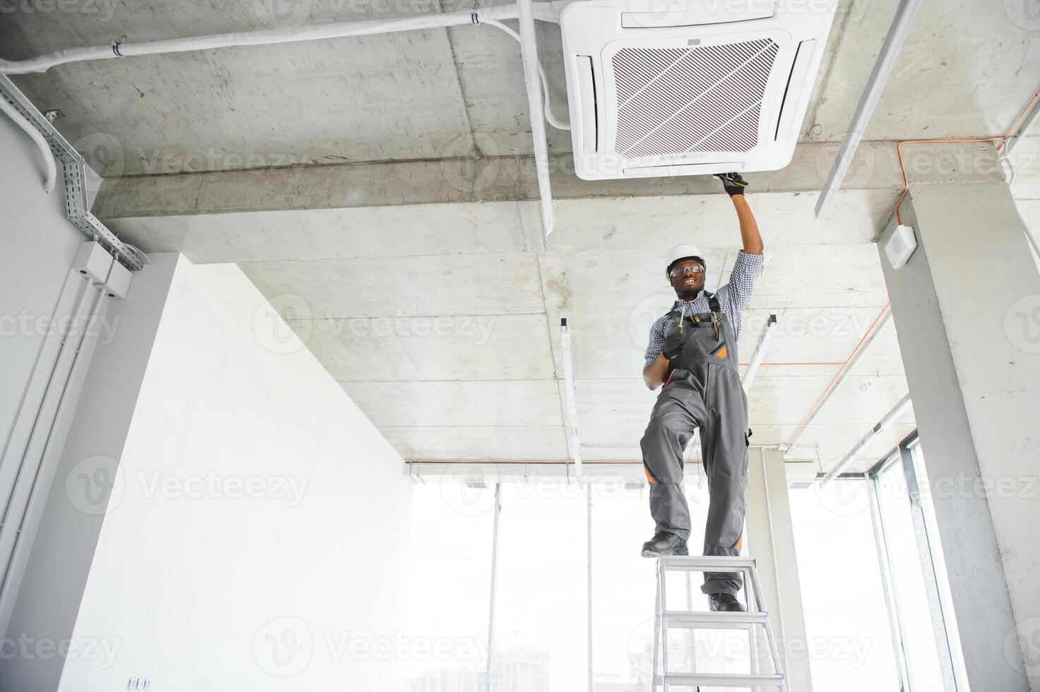 AC Electrician Technician Repairing Air Conditioner Appliance photo