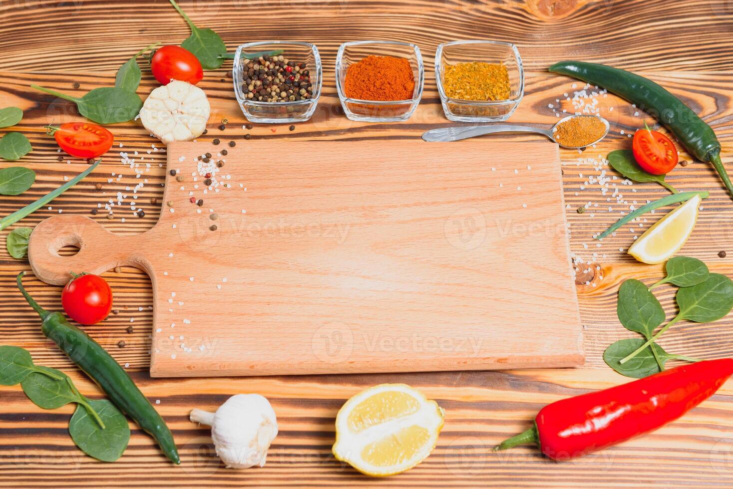 Cooking table. Background with spices and vegetables. Top view. Free space for your text photo