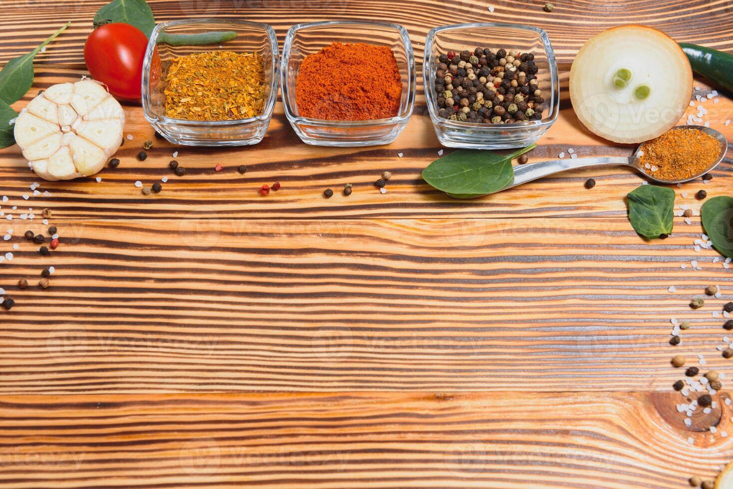 Cooking table. Background with spices and vegetables. Top view. Free space for your text photo
