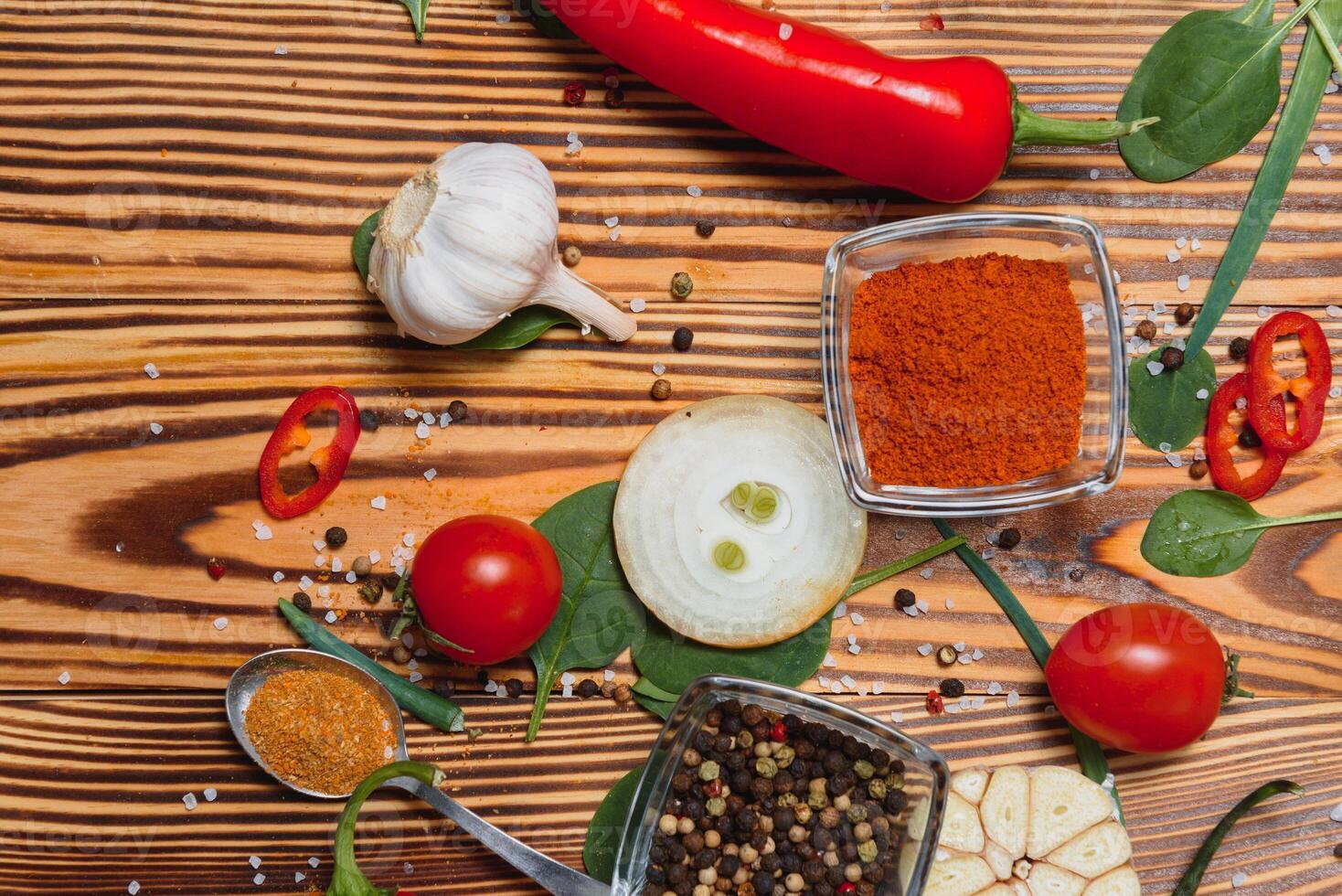 Spices and herbs over wooden background, healthy or cooking concept photo