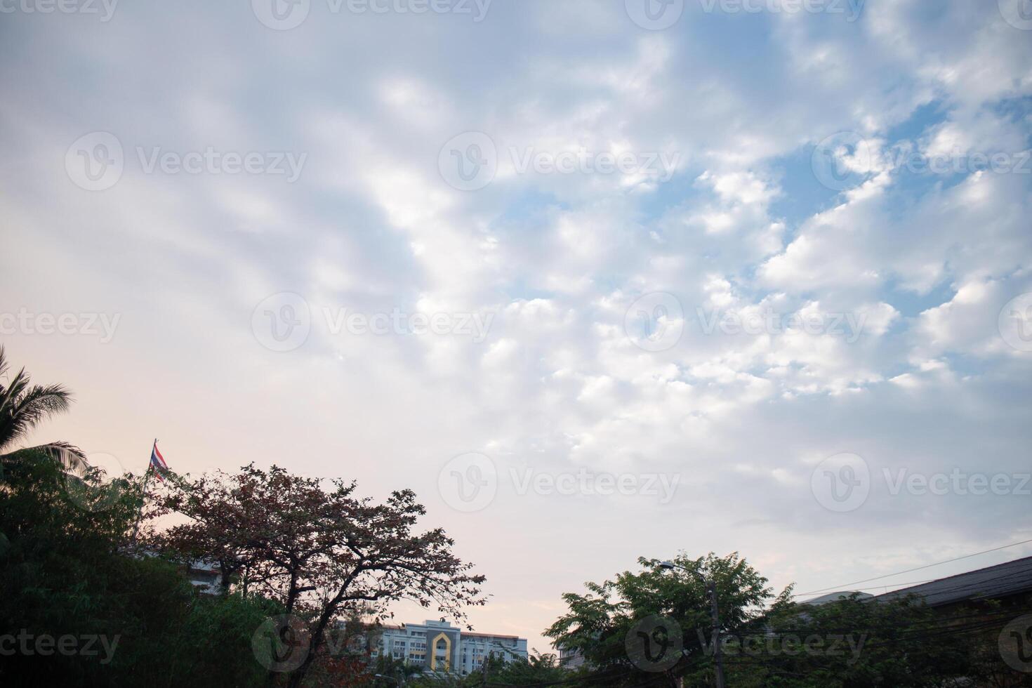 orange blue skyscape background with cloud and city town building in evening of the day sunset twilight dusk time photo