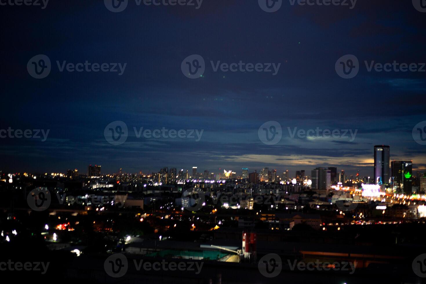 orange blue skyscape background with cloud and city town building in evening of the day sunset twilight dusk time photo