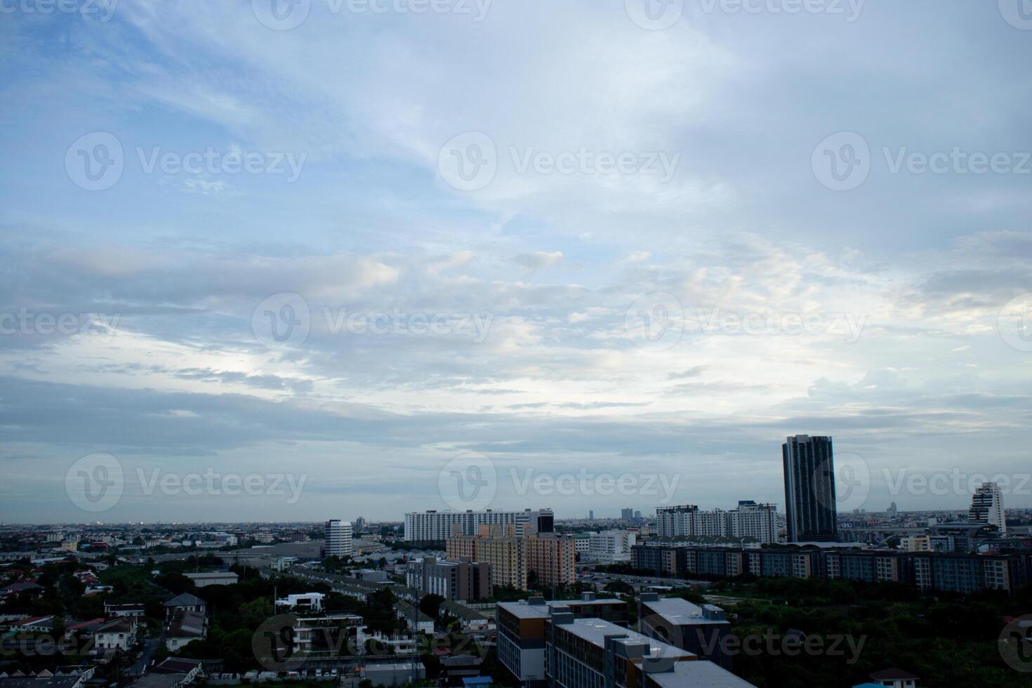 reflection light sun ray from beside white clouds in cloudy daytime with dusk sunrise sunset twilight time sky with city high view photo