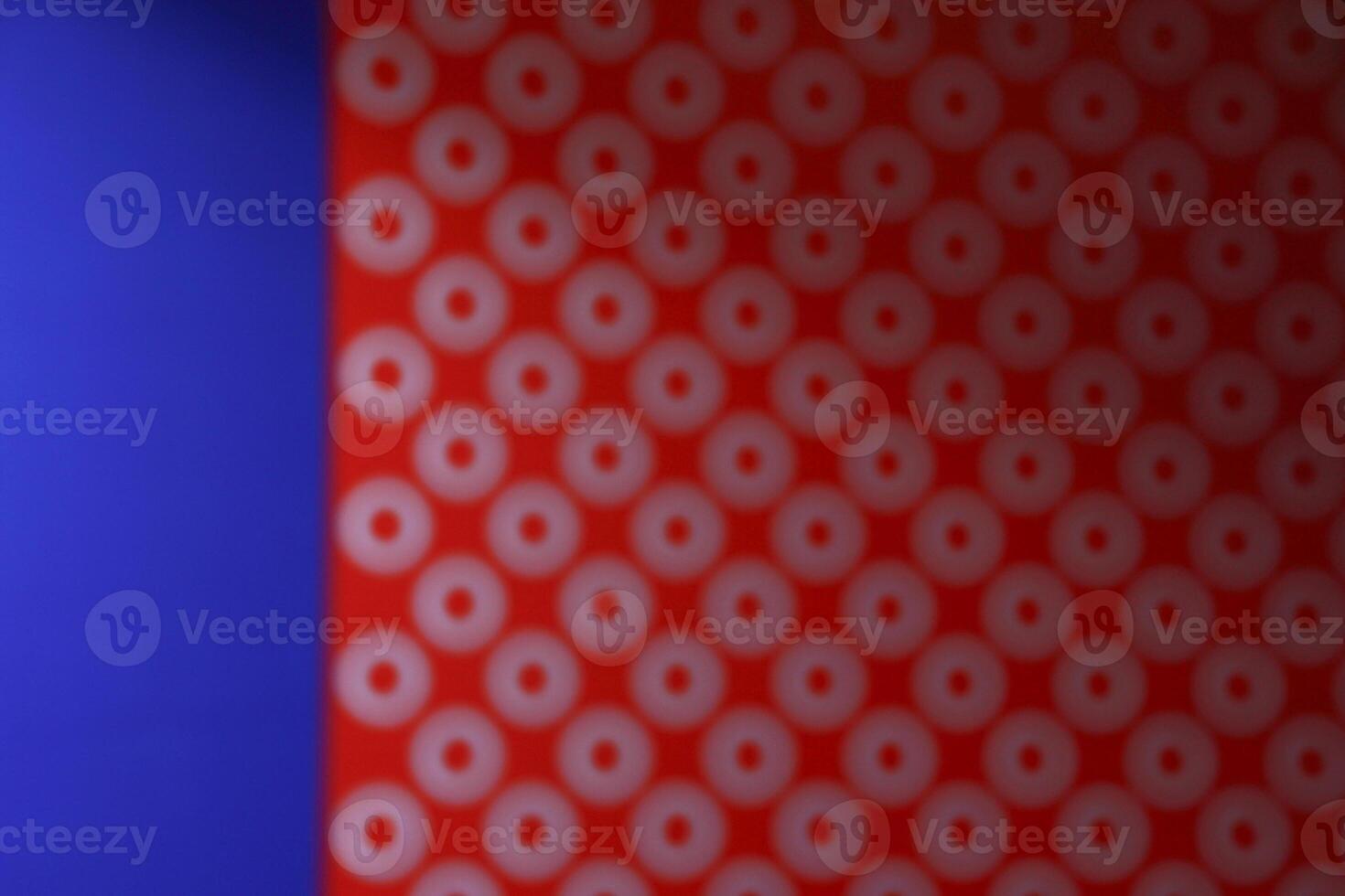 red and blue background with a dot pattern photo