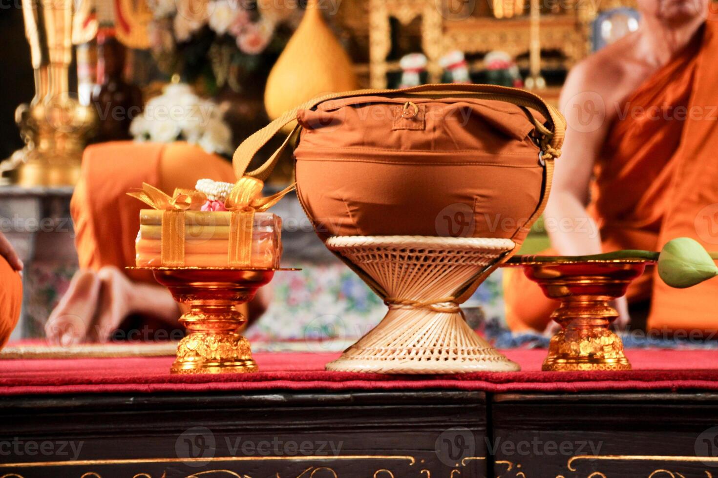 monk's alms bowl , candle and lotus flower on golden tray in ordination ceremony to be monk tradition in Bangkok Thailand Buddhism temple on 11 June 2017 photo