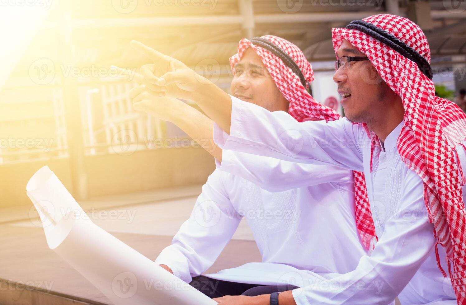 In town.Muslim Arab engineer man.They are talking about plant ,exchange information and Targeting . Photo concept with Arab engineer.