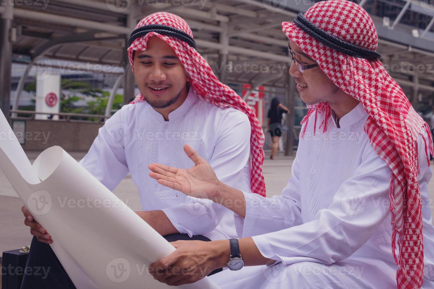 In town.Muslim Arab engineer man.They are talking about plant ,exchange information and Targeting . Photo concept with Arab engineer.