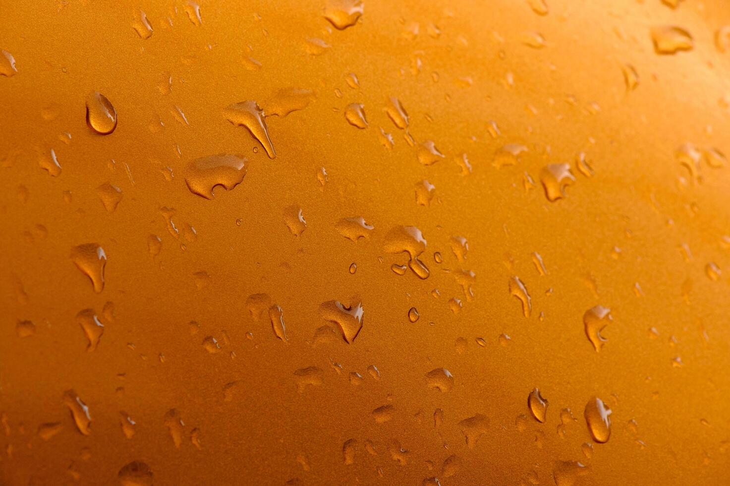 Background - raindrops on the metal surface of a modern car photo