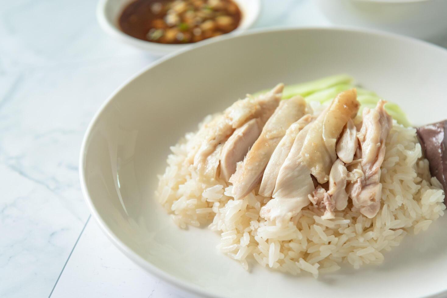 Hainanese Chicken rice with salted soya beans sauce and soup photo