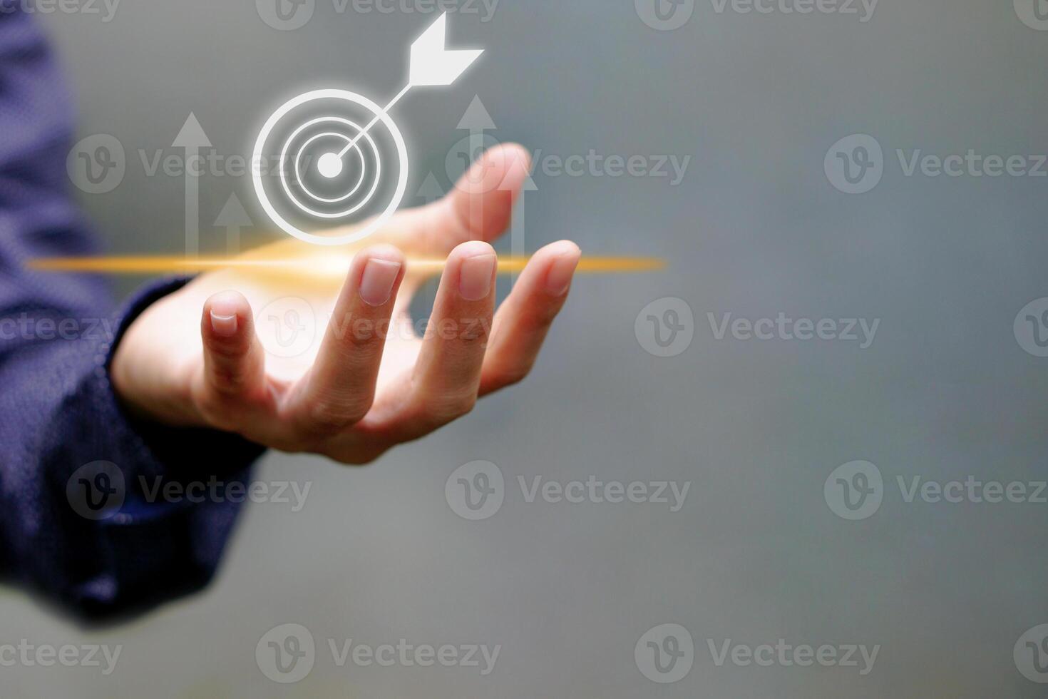 Businessman touching target icon virtual and up arrow. Strategic planning and business success. photo