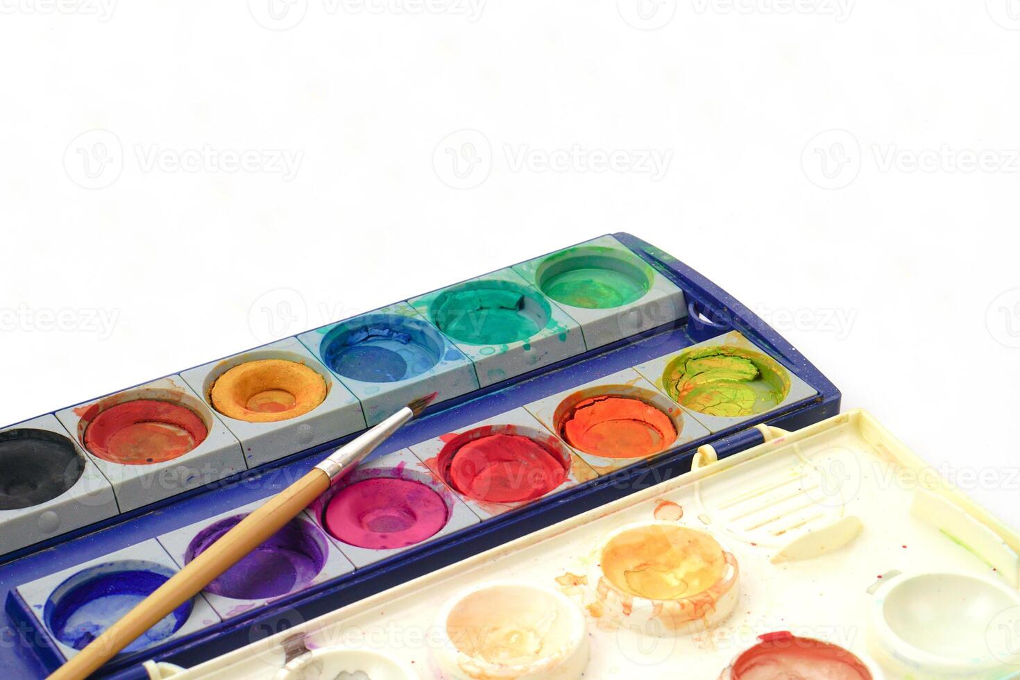 Dried palette and brush on white background. Learning and paintings art concept. photo
