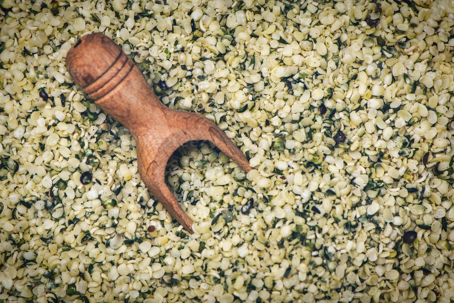 Hemp seeds with wooden scoop photo