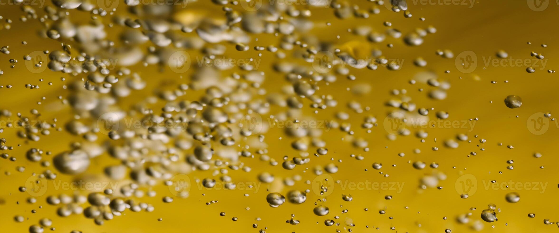 Golden Hyaluron Oil bubbles collagen serum or yellow oil bubbles drop texture background photo