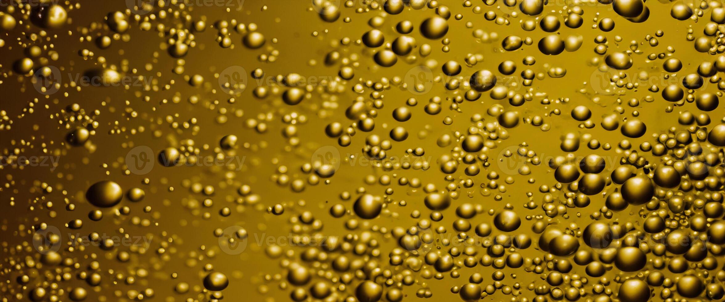 Golden Hyaluron Oil bubbles collagen serum or yellow oil bubbles drop texture background photo