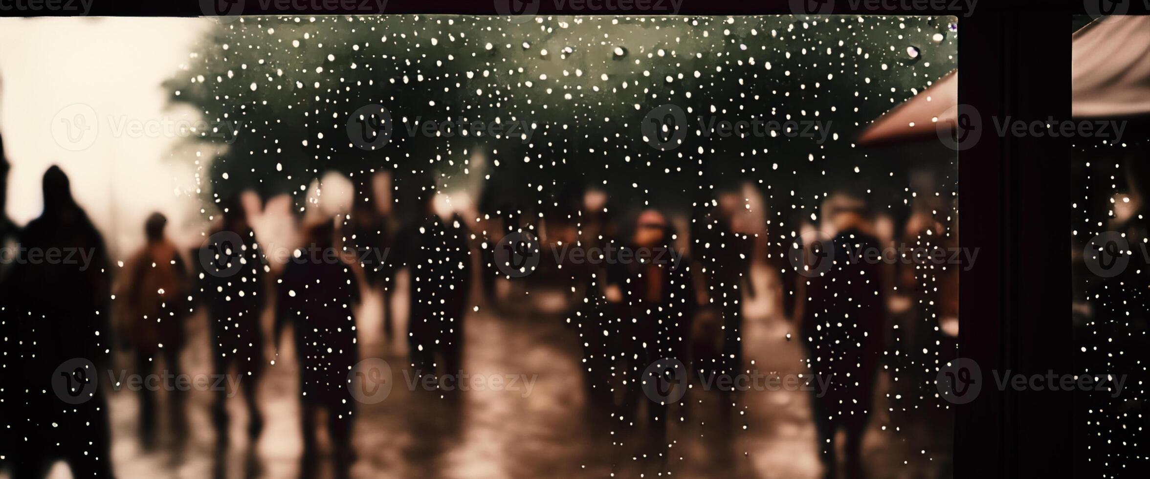 Rain drop on window glass of coffee shop and blurry city life background. Rainy season and blurry people city day life or bokeh night lights outside window. Coffee shop window covered with rain water photo