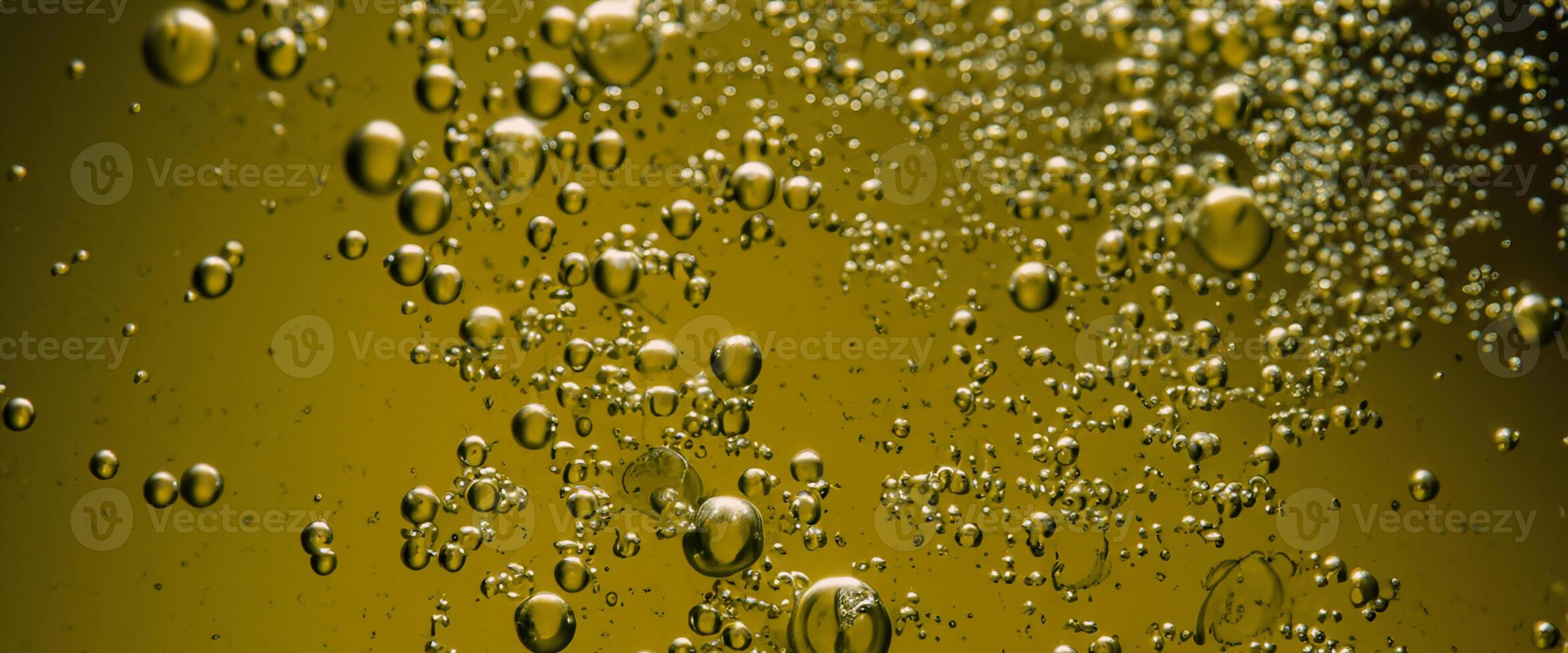 Golden Hyaluron Oil bubbles collagen serum or yellow oil bubbles drop texture background photo
