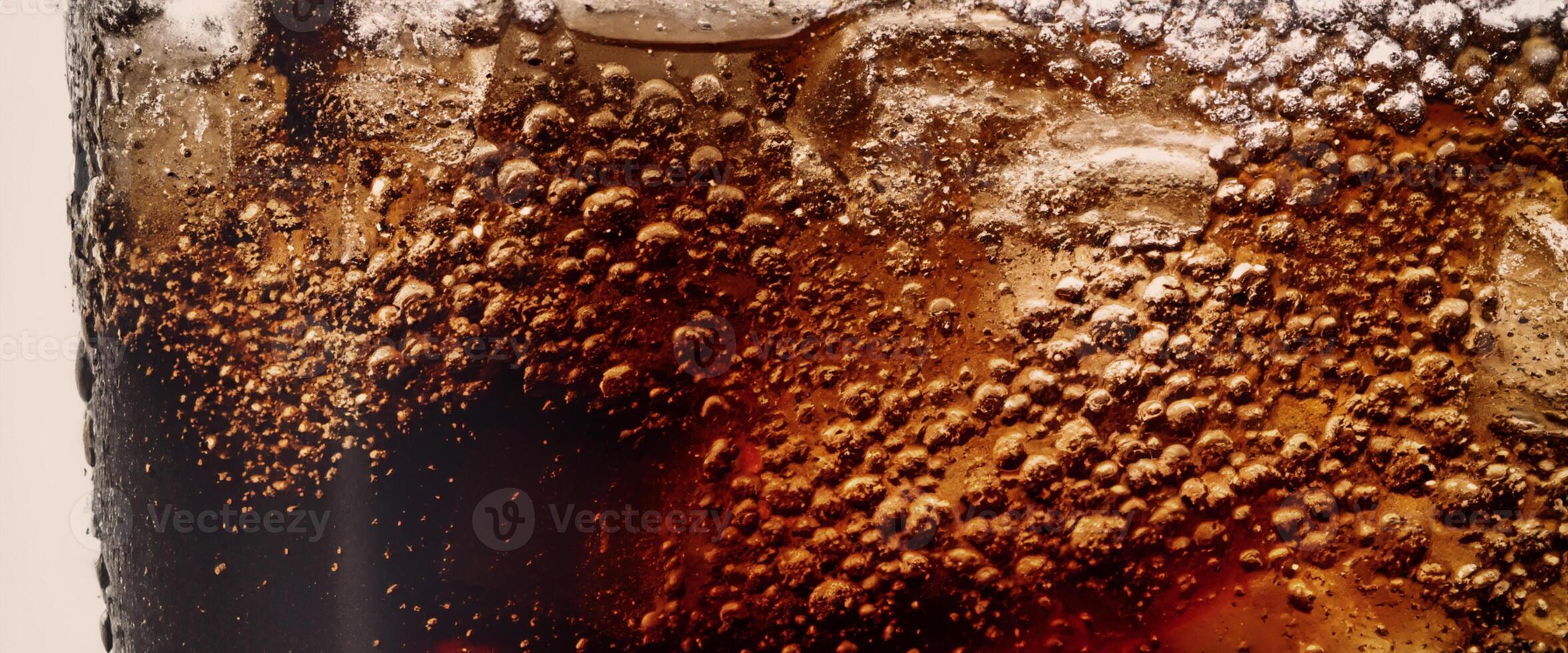 Cola soda and ice splashing fizzing or floating up to top of surface photo