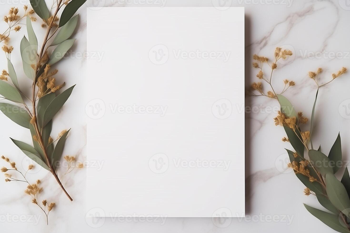 Wedding invitation or card mockup. Blank white sheet of copy space on a natural stone surface, decorative twigs with leaves. photo