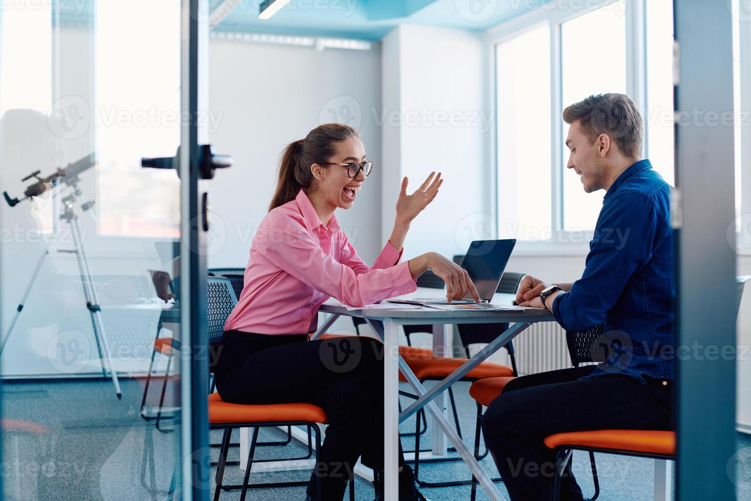 A furious business director of a startup office berating her employee for business mistakes and errors photo