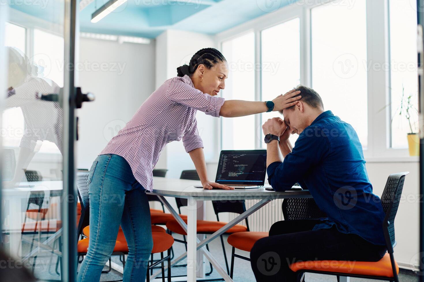 A furious business director of a startup office berating her employee for business mistakes and errors photo